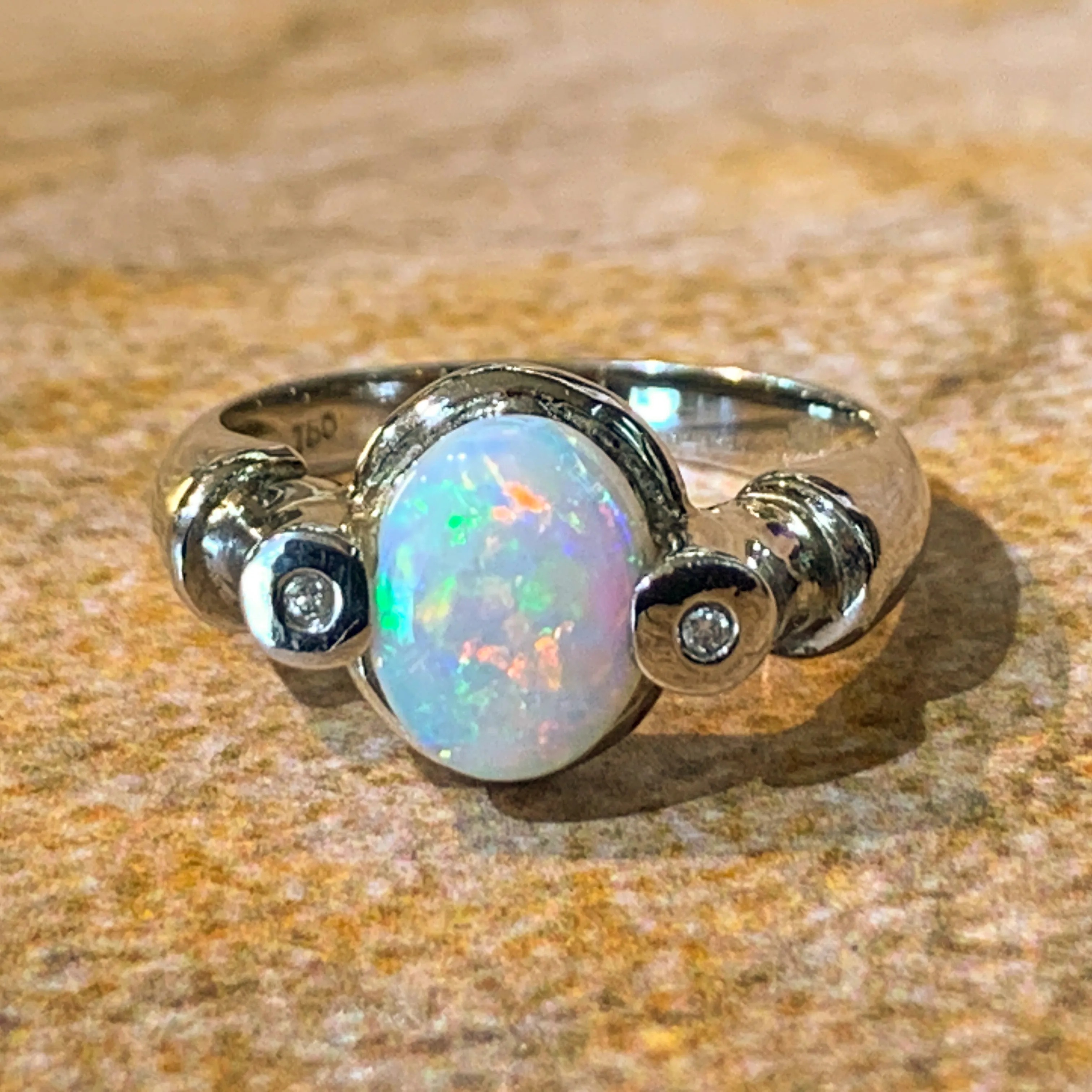 18kt White Gold Crystal Opal 9x7mm and 2 Diamond ring