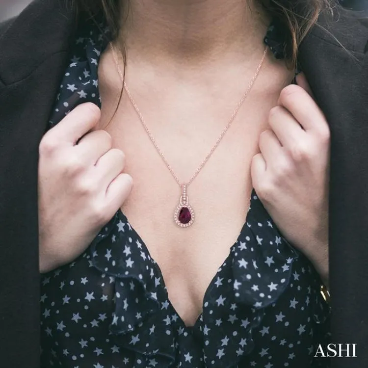 7x5 MM Pear Shape Rhodolite Garnet and 1/10 Ctw Round Cut Diamond Pendant in 10K Rose Gold with Chain