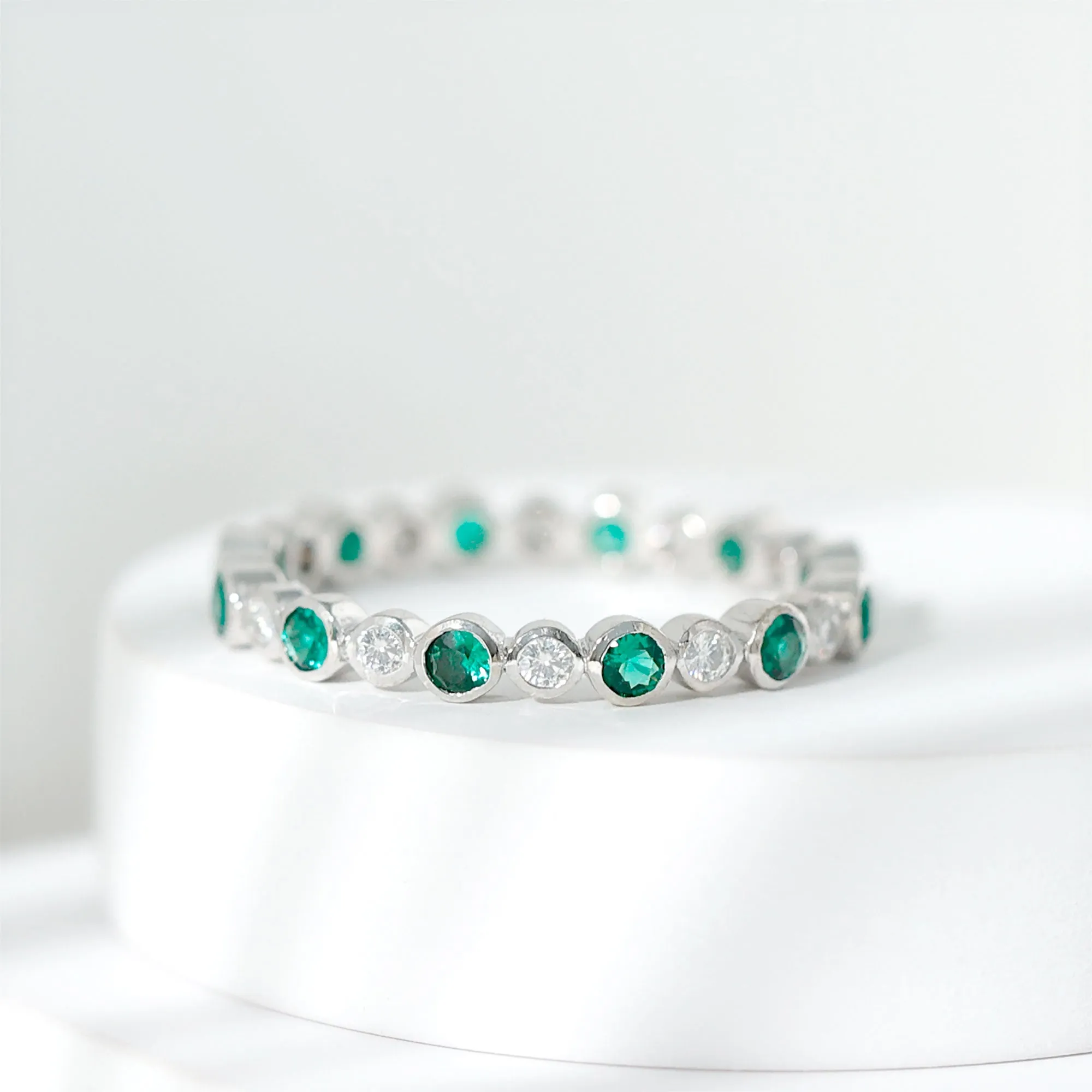 Round Lab Created Emerald Moissanite Eternity Band Ring